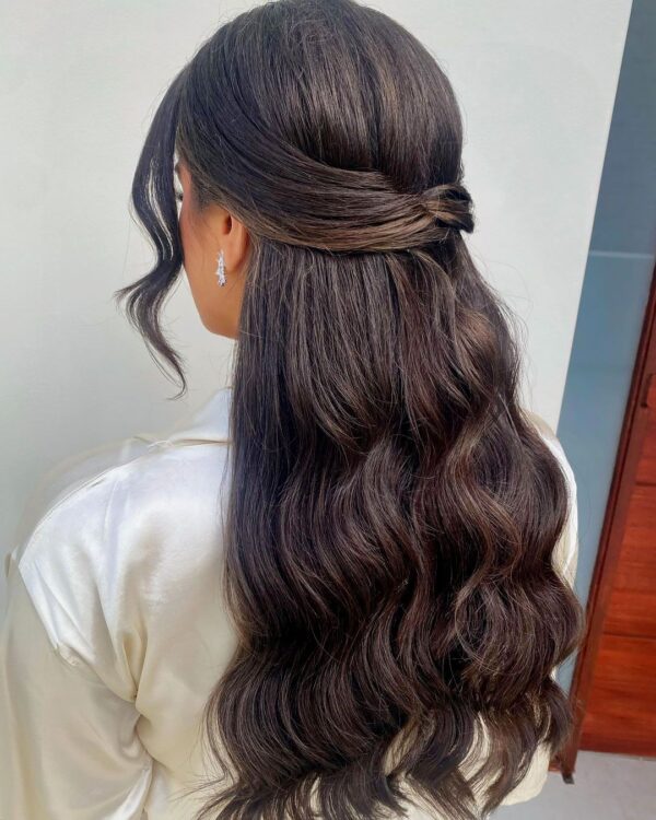 Half-up half-down hairstyle with loose curls